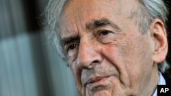 FILE - Elie Wiesel, pictured during an interview in December 2009, survived Nazi brutality to start a career as a journalist. He died Saturday at age 87.
