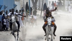 Somali students from the Yahya Fardoole horse training center race horses as part of their training in Mogadishu, Somalia on February 25, 2022. (REUTERS/Feisal Omar)