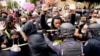 Police push back protesters during a demonstration after a decision by a grand jury in the police shooting death of Breonna Taylor, in Louisville, Kentucky, Sept. 23, 2020.