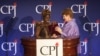Mae Azango receiving CPJ award from AP Executive Editor Kathleen Carroll 