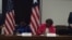 US Assistant Secretary for African Affairs Linda Thomas Greenfield and Liberian Foreign Minister Marjon Kamara sign a statement on US-Liberia cooperation.