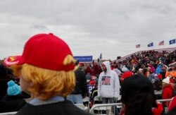 Supporters of U.S. President Donald Trump gather for a Trump re-election campaign rally in Waterford Township, Michigan, Oct. 30, 2020.