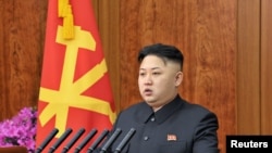 Shugaban Koriya ta Arewa kennan, Kim Jong Un a lokacin da yake jawabin sabuwar shekara. Junairu 1, 2013. 