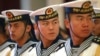 FILE - A military honor guard prepares for U.S. Chief of Naval Operations Admiral Jonathan Greenert's visit with Commander in Chief of the PLA Navy Adm. Wu Shengli at a welcoming ceremony at the PLA Navy headquarters outside Beijing, China, July 15, 2014.