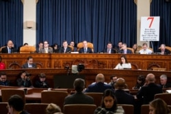 House Intelligence Committee Chairman Adam Schiff, center, gives his closing remarks as U.S. Ambassador to the EU Gordon Sondland testifies before the committee on Capitol Hill in Washington, Nov. 20, 2019.