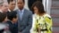 U.S. first lady Michelle Obama, right, is greeted by an unidentified Japanese official upon her arrival at Haneda International Airport in Tokyo, March 18, 2015. 