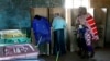 A Masai woman walks towards ballot boxes to cast her vote in a general election in Kajiado West, some 60 kilometers (37 miles) from Nairobi, Kenya, Monday, March 4, 2013. 