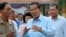 FILE - Cambodian Prime Minister Hun Sen, center, of ruling Cambodian People's Party speaks after voting in the senate election at Takhmau polling station in Kandal province, southeast of Phnom Penh, Cambodia, Feb. 25, 2018.