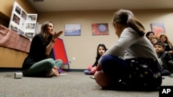 FILE - In this Jan. 23, 2019 photo, Bahareh Hedyahe leads Persian story time at Irvine public library in Irvine, Calif.