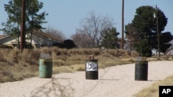 The driveway to the Shatto family home, rear left, is seen in Gardendale, Texas, Friday, March 1, 2013.