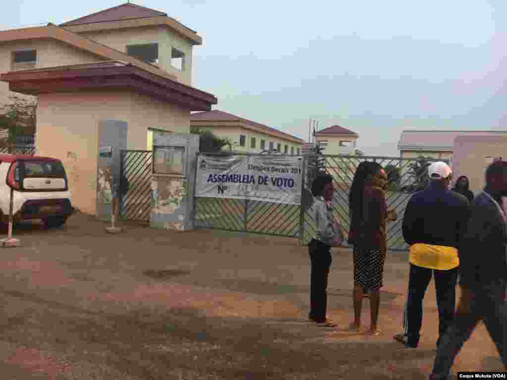 Voters wait for a polling station to open in Luanda, Angola, Aug. 23, 2017.