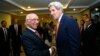 U.S. Secretary of State John Kerry is greeted by Pakistan's National Security Advisor Sartaj Aziz (L) shortly after arriving in Islamabad, Jan. 12, 2015.
