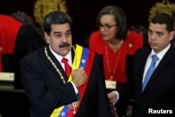 Venezuela's President Nicolas Maduro gestures during a ceremony to mark the opening of the judicial year at the Supreme Court of Justice (TSJ), in Caracas, Venezuela, Jan. 24, 2019.