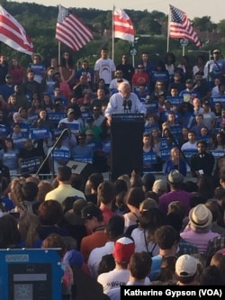 Democratic presidential candidate Bernie Sanders speaks to supporters at a rally in a parking lot at R.F.K. Stadium, in southeast Washington, June 9, 2016.