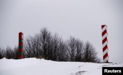Poland -- Polish and Russian border signs are seen on the border with Russia in Zytkiejmy, February 9, 2017