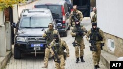 Soldiers of the European Union Rule-of-Law (EULEX) in Kosovo carry out special operations at the house of the former Parliament speaker of Kosovo and former Kosovo Liberation Army (KLA) spokesman Jakup Krasniqi in Pristina, Nov. 4, 2020.