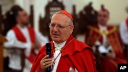 FILE - Patriarch of the Chaldean Catholic Church, Cardinal Louis Sako, addresses the faithful during a service at at Mar Youssif Church in Baghdad, Iraq, April 14, 2019.