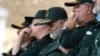 Gen. Qassem Soleimani, center, who heads the elite Quds Force of Iran's Revolutionary Guard attends a graduation ceremony of a group of the guard's officers in Tehran, Iran, June 30, 2018.