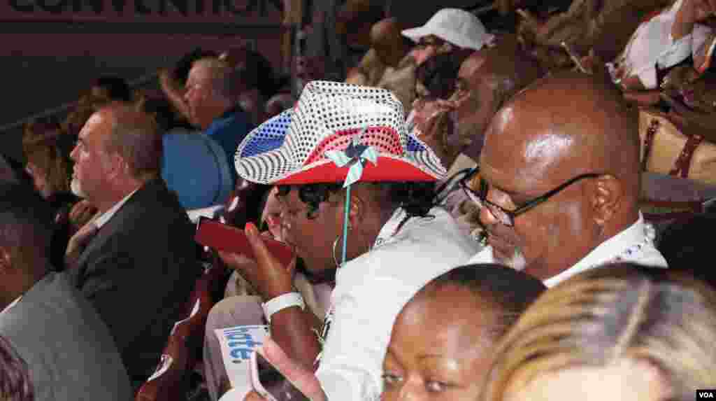 Delegates sport their hats at the DNC in Philadelphia (Photo: S. Barua/VOA)