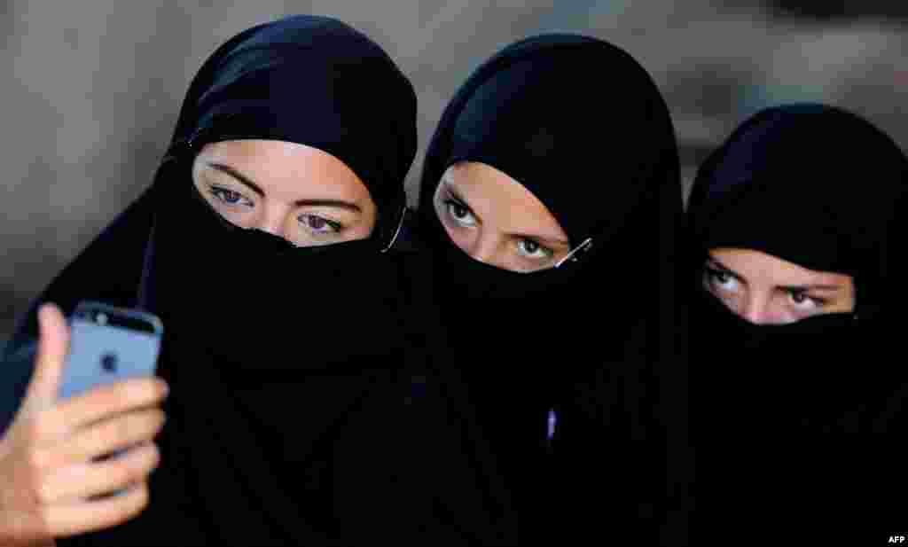 Georgian actors take a group selfie wearing veils before taking part in a joint Georgian-U.S. military counterterrorism exercise called &quot;Agile Spirit 2014&quot; at the Vaziani military base outside Tbilisi.