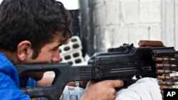 Batoul Bashir Ahmad, a five-month-old child suffering from dehydration, is carried by his mother, a displaced Iraqi woman who fled her home during a battle between Iraqi forces and Islamic State militants, in Mosul.