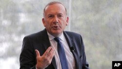 FILE - Head of the French employers' union MEDEF, Pierre Gattaz delivers his speech during the opening of France employer's union MEDEF annual meeting in Jouy en Josas, outside Paris, Aug. 26, 2015. 