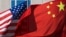 U.S. flag and China's flag flutter in winds at a hotel in Beijing, Sept. 5, 2012.