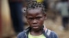 A girl walks along a street in the sprawling Kibera slum, in Nairobi, Kenya, Aug. 26, 2011.