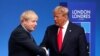 FILE - Britain's Prime Minister Boris Johnson shakes hands with U.S. President Donald Trump during a welcoming ceremony at the NATO leaders summit in Watford, Britain, Dec. 4, 2019. 