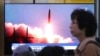 FILE - A TV screen shows an image of North Korea's missile launch during a news program at the Seoul Railway Station in Seoul, South Korea, July 26, 2019. 