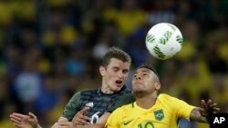 A hundred activists hold portraits of President Emmanuel Macron upside down to urge France to take action during the U.N. COP 25 climate talks in Madrid, Spain, during a gathering at Place du Trocadero facing the Eiffel Tower in Paris.