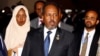 Somali's President Hassan Sheikh Mohamud is escorted as he leaves a meeting of the 28th Ordinary Session of the Assembly of the Heads of State and the Government of the African Union in Ethiopia's capital Addis Ababa, Jan. 30, 2017.