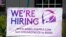 FILE - A hiring sign is displayed outside a restaurant during the COVID-19 pandemic in Glenview, Ill., May 8, 2021. 
