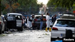 Police forensic experts examine the scene of blast in Istanbul, Turkey, Oct. 6, 2016.