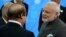 Indian Prime Minister Narendra Modi, right, speaks to Prime Minister of Pakistan Muhammad Nawaz Sharif, in Ufa, Russia, July 10, 2015.