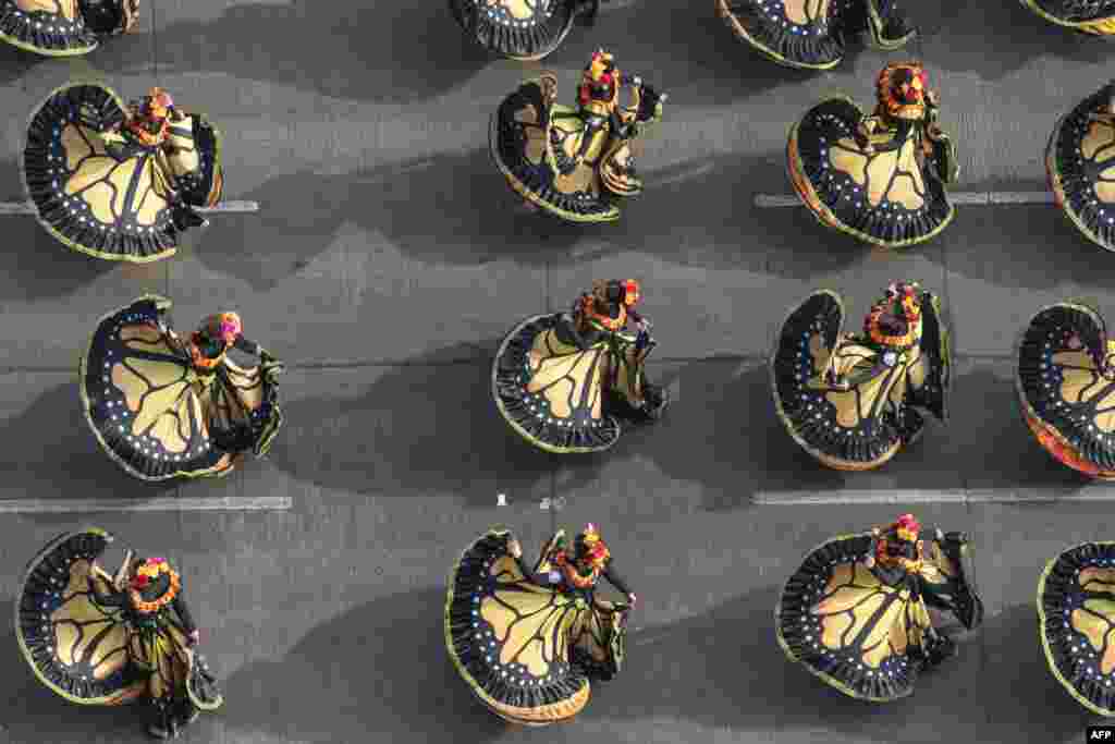 Dancers take part in the Grand Parade to commemorate the Day of the Dead in Mexico City, Nov. 2, 2024. 