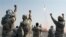 FILE - Iranian Revolutionary Guards celebrate after a missile is launched in Iran, July 3, 2012. Kurdish rebels on Friday clashed with Iran's Revolutionary Guards for a second consecutive day in a border area between Iraq and Iran.