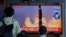 People watch a TV screen showing a news program reporting about North Korea's missiles with file image in Seoul, South Korea, Wednesday, Sept. 15, 2021. North Korea fired two ballistic missiles into waters off its eastern coast Wednesday afternoon,…
