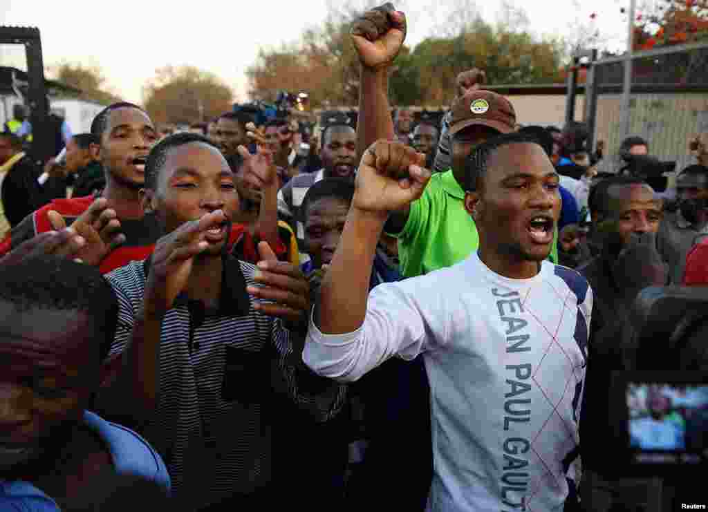 Released mine workers celebrate their release at Ga-Rankuwa Magistrate's Court, Pretoria, South Africa, Monday, Sept. 3, 2012.