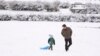 Winter storm dumps snow in US South, maintains its icy grip 