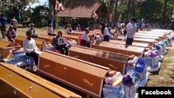 Forty coffins were given to aging villagers in a ceremony, where they were placed in a line, Samki commune in Kampong Thom province was photographed early this month​​ and went viral on social media Facebook. (Facebook) 