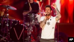 Adam Levine of Maroon 5 performs onstage during "A Very Grammy Chrismas" at The Shrine Auditorium in Los Angeles, California, Nov. 18, 2014.