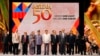 FILE: Philippine President Rodrigo Duterte, sixth from left, poses with descendants and representatives of the ASEAN Founding Fathers at the closing ceremony of the 50th ASEAN Foreign Ministers Meeting and its 50th Grand Celebration Tuesday Aug. 8, 2017 at the Philippine International Convention Center in Manila, Philippines. (AP Photo/Bullit Marquez)
