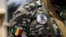 A soldier wears a button bearing the image of coup leader Capt. Amadou Haya Sanogo with the words 'President, CNRDRE,' the French acronym of the ruling junta, outside Bamako, Mali, April 1, 2012. 