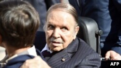 FILE - Algerian President Abdelaziz Bouteflika is seen while voting at a polling station in Algiers, Nov. 23, 2017.