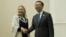 U.S. Secretary of State Hillary Rodham Clinton, left, and Chinese Foreign Minister Yang Jiechi pose for photos before their meeting on the sideline of the ASEAN regional forum in Phnom Penh, July 12, 2012.