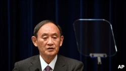 Japan's Prime Minister Yoshihide Suga attends a news conference at the prime minister's official residence in Tokyo, Aug. 25, 2021. 