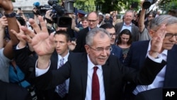 FILE - Alexander Van der Bellen, winner of Austria's presidential election, waves to his supporters in Vienna, May 23, 2016.