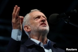 Britain's Labor Party leader Jeremy Corbyn speaks during a rally ahead of his party's annual conference, in Liverpool, England, Sept. 22, 2018.