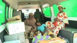 Two boys and two Pregnant women, both former militants, receive assistance in an ambulance in Mora, Sept. 18, 2021.